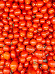 lots of ripe red tomato cooking as a background