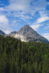 Experience the breathtaking beauty of the high alpine mountain landscape of the Zugspitze area in the Alps, with its stunning peaks and tranquil atmosphere. Perfect for outdoor activities and nature
