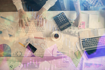Double exposure of man and woman working together and financial chart hologram drawing. market analysis concept. Computer background. Top View.