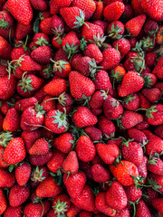 lots of ripe sweet strawberry fruit for cooking as a background
