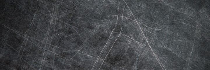 back to school: black chalkboard with blurry traces of white chalk and crayons, minor scratches