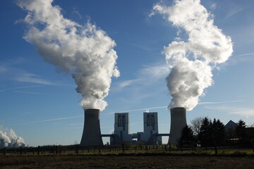 Fototapeta na wymiar Coal-fired power station in Neurath, which generates steam from cooling towers