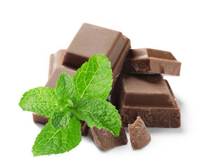 Tasty milk chocolate pieces and mint on white background