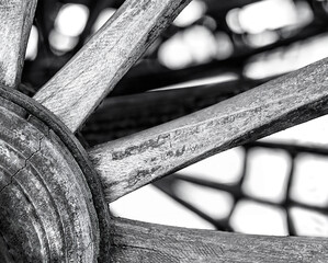 Detail of an old wagon wheel in the field