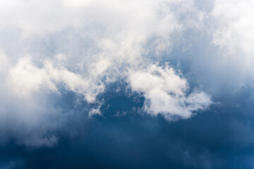 Obraz premium Dramatic thunderstorm clouds in sky before rain. Natural weather cloudscape background