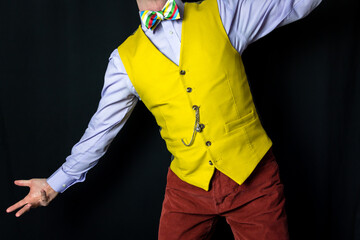 Portrait of Man in Bright Yellow Vest in Flamboyant Pose