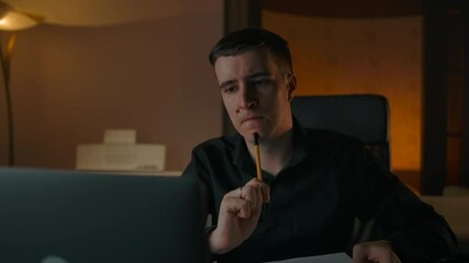 A man prepares to learn online with a tablet, pen and glasses. Clever handsome caucasian male writing notes on notepad for solving equation and decide problem. - Powered by Adobe