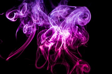 Fototapeta na wymiar Colored smoke on black background