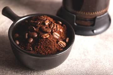 Ground coffee and coffee beans in