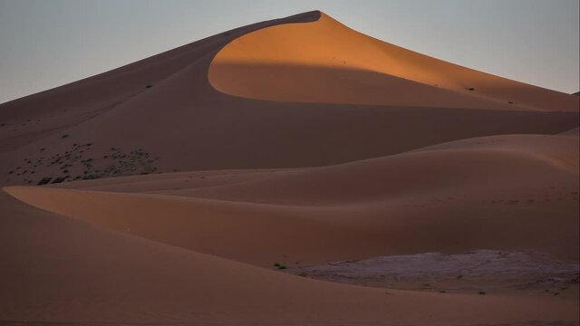 Time lapse of shadows on sand dunes in Sahara desert