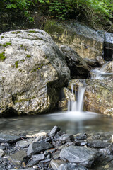 Fototapeta na wymiar Wonderful clear water creek in french alps with rocks