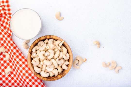 Vegan Cashew Nut Milk On White Background. Non Dairy Alternative Vegan Milk. Healthy Vegetarian Food And Drink. Copy Space, Top View