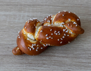 Braided lye bread roll with salt