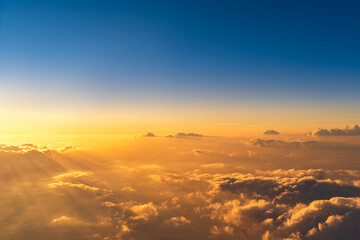 The sea of clouds in the morning seen from the plane.
