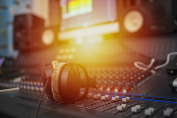Music on sound mixer in recording studio.