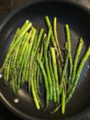  asparagus saute in a pan