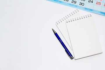 notebooks and a pen on the table for information. A place for text. Business, marketing, financial concept