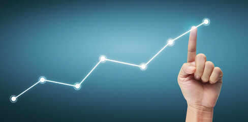 Hand touching a graphs of financial indicator accounting market economy analysis chart