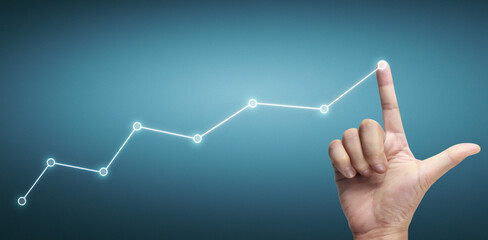 Hand touching a graphs of financial indicator accounting market economy analysis chart