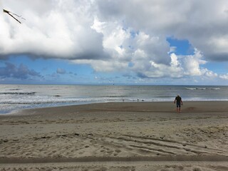 people walking on the beach