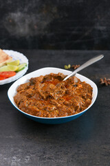 Kerala beef curry , Goan style beef vindaloo , Indian food Lamb or beef curry . spicy Beef curry gravy popular in Kerala Sri Lankan Goa side dish for Appam, Parotta porotta roti bread in India.