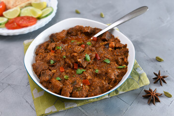 Kerala beef curry , Goan style beef vindaloo , Indian food Lamb or beef curry . spicy Beef curry gravy popular in Kerala Sri Lankan Goa side dish for Appam, Parotta porotta roti bread in India.