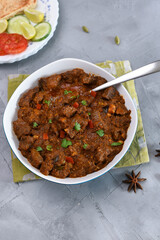 Kerala beef curry , Goan style beef vindaloo , Indian food Lamb or beef curry . spicy Beef curry gravy popular in Kerala Sri Lankan Goa side dish for Appam, Parotta porotta roti bread in India.