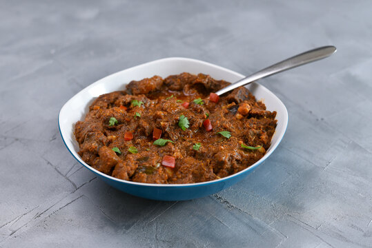 Kerala beef curry , Goan style beef vindaloo , Indian food Lamb or beef curry . spicy Beef curry gravy popular in Kerala Sri Lankan Goa side dish for Appam, Parotta porotta roti bread in India.