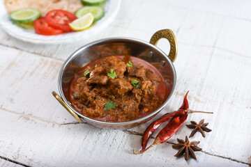 Spicy Kerala beef curry , Goan style beef vindaloo , Traditional Indian Lamb or beef curry . spicy Beef curry gravy popular in Sri Lankan Goa side dish for Appam, Parotta porotta roti bread in India.