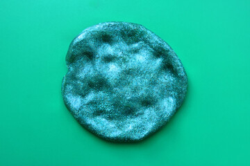  textured  colorful  slime with glitter inside. Macro of kids toy slime. Selective focus     