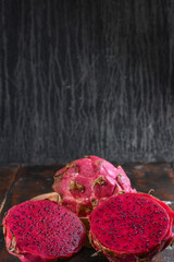 Red dragon fruit or pitahaya fruit on wooden background