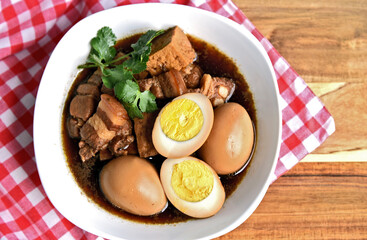 Thai Stewed Pork & Eggs with Five Spices (Thai name is Kai Pa Lo)..Famous Thai egg menu.