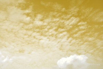 Golden sky with white clouds. Beautiful sky background and wallpaper for design and texture background.