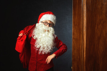 A child in the image of Santa Claus in the Studio