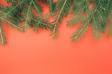 Christmas flat composition of fir branches with copy space for text. Top view on white background