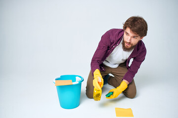 Cleaner with a bucket on the floor professional detergent service