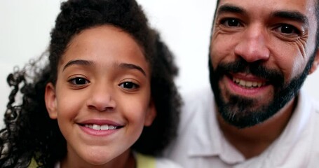 Little girl kissing father on the cheek. Dad and daughter bonding. Family love and affection