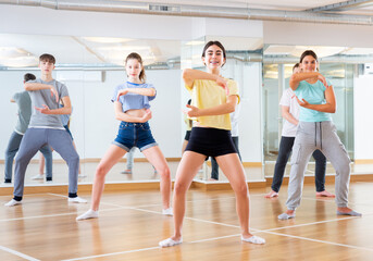 Group of teenage boys and girls enjoying dance class together