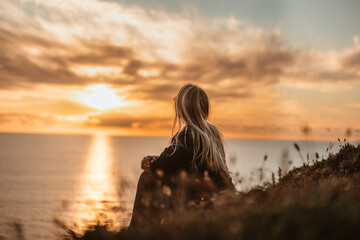 woman on the beach at sunset
