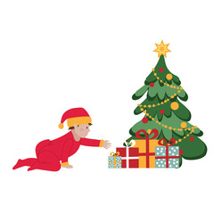 Christmas. A cute little baby in a red overalls and a santa claus hat is reaching for a Christmas present.