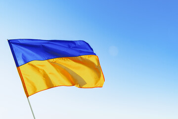 Flag of Great Britain waving against blue sky