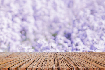 abstract blur lavender agriculture farm and gardening background with perspective wood table for...