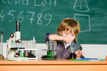 school kid scientist studying science. little boy at lesson. Back to school. science experiments with microscope in lab. Little boy is making science experiments. biology science. Knowledge day