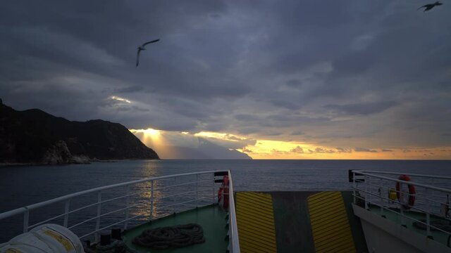 Ferry boat cruise toward Mount Athos at sea at sunrise, Greece