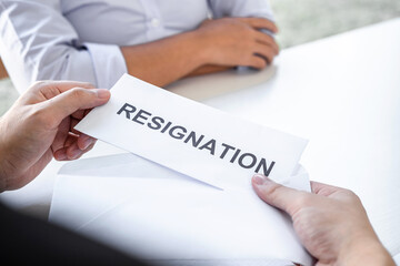Image of business woman hand sending a resignation letter to executive boss, Change of job, unemployment, resign concept