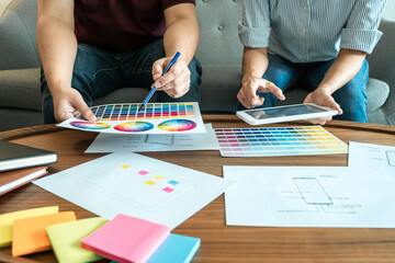 Fototapeta premium Team of Creative Web/Graphic Designer planning, drawing website ux app for mobile phone application and development template layout, process to developing prototype wireframe, User experience concept