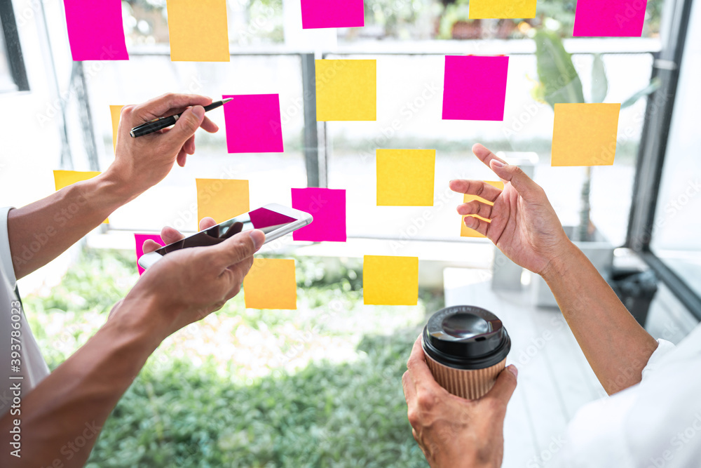 Poster business team working marketing growth on financial document graph report statistics, using post it 