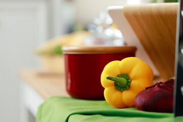 Fresh ripe bell pepper on wooden table