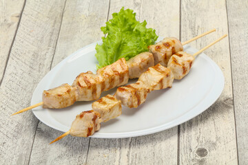 Grilled pork skewer served salad