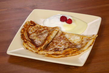 Pancakes with sour cream and condenced milk
